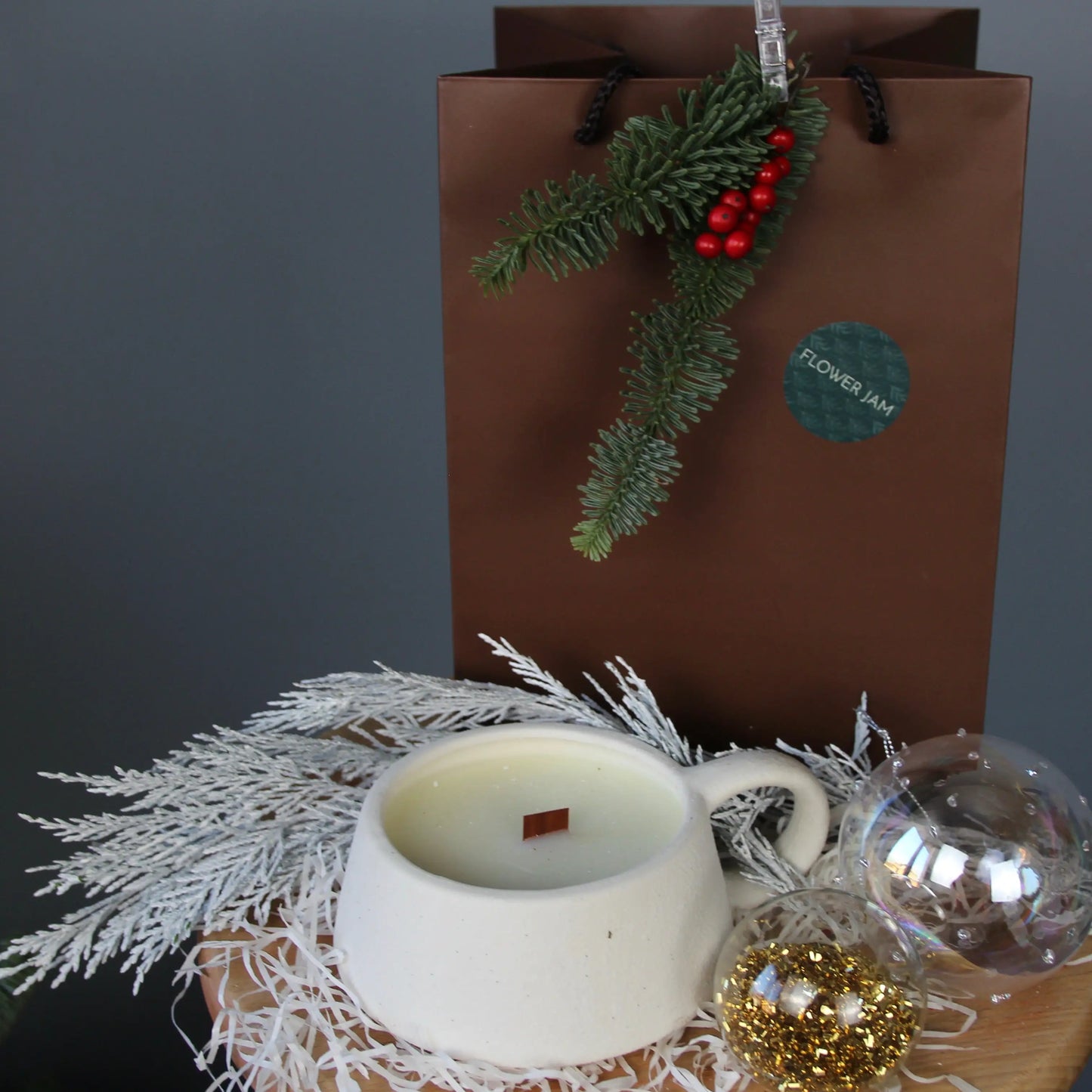 white candle in a white cup gift