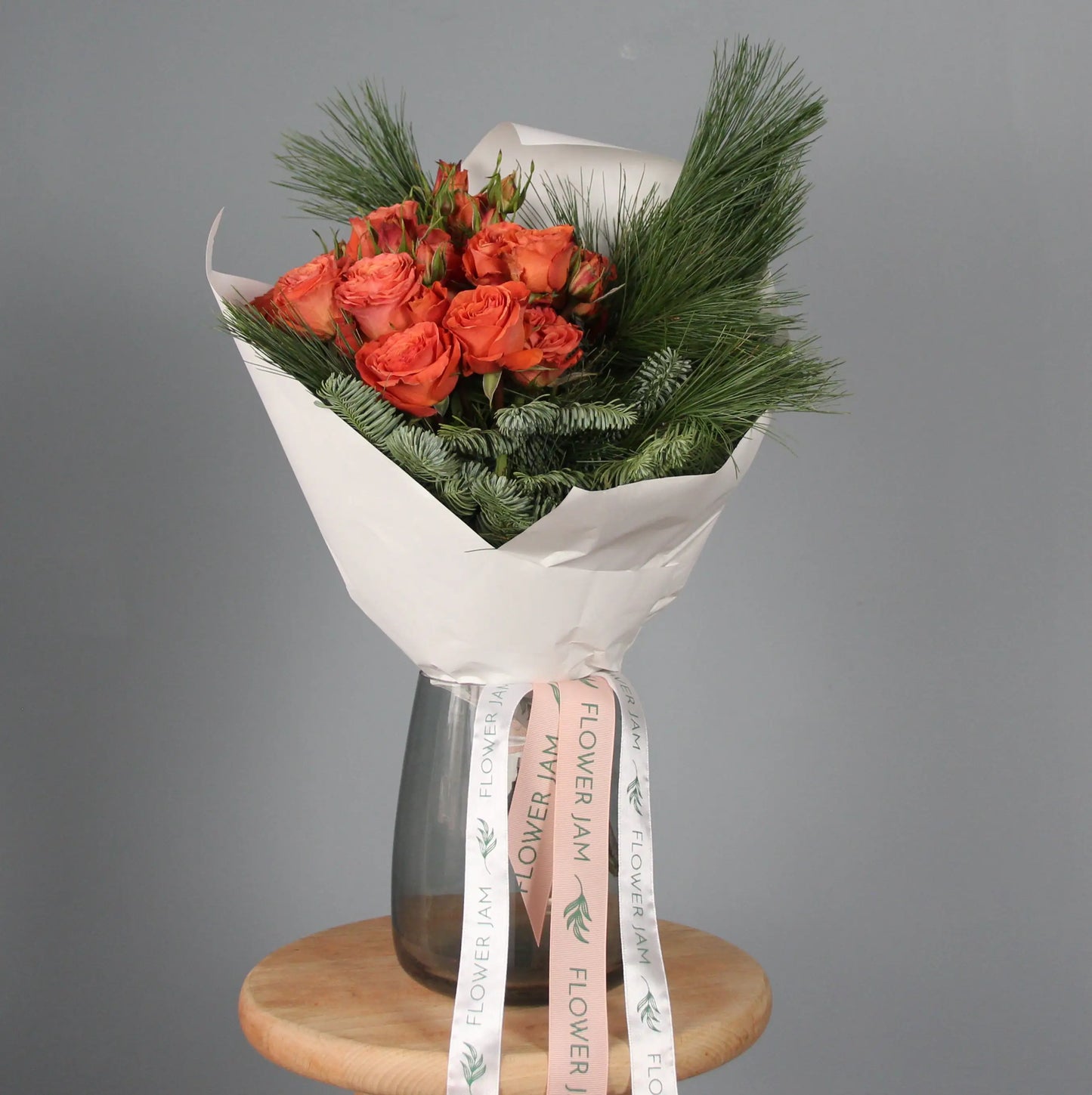 Orange roses and spruce branches bouquet Bouquet of Flowers