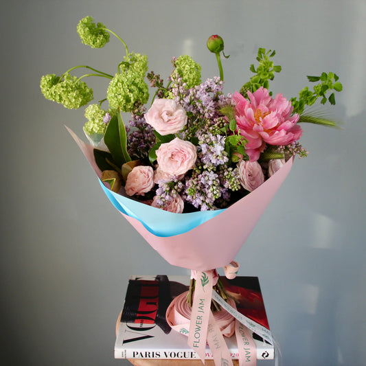 bouquet of pink flowers and greenery