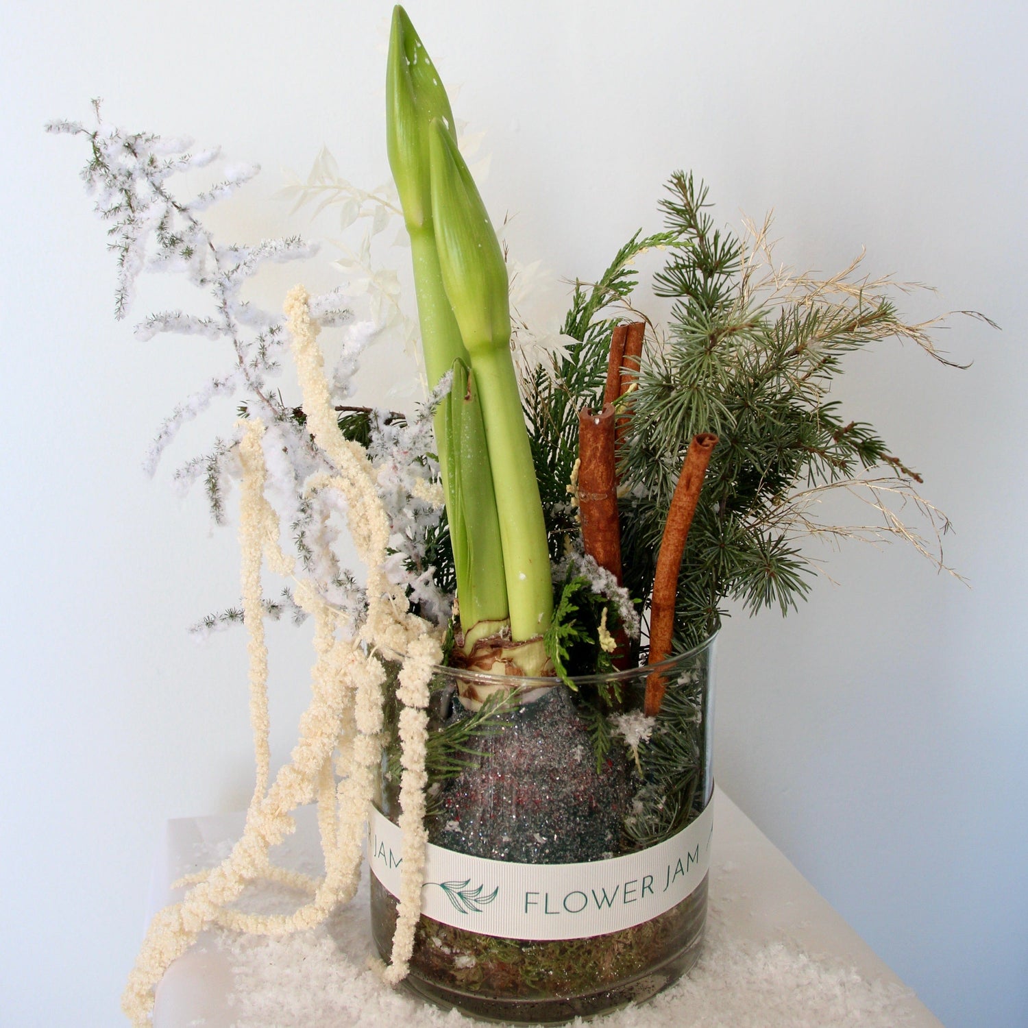 Decorative Christmas arrangement with cinnamon and a pine tree

