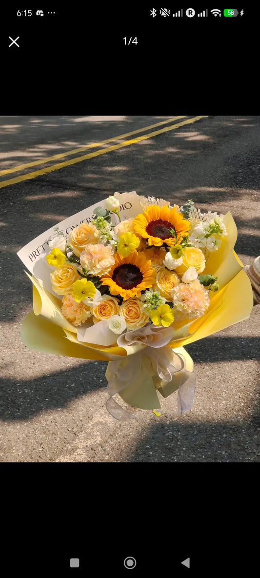 yellow bouquet with 2 big sunflowers and other yellowish and white flowers