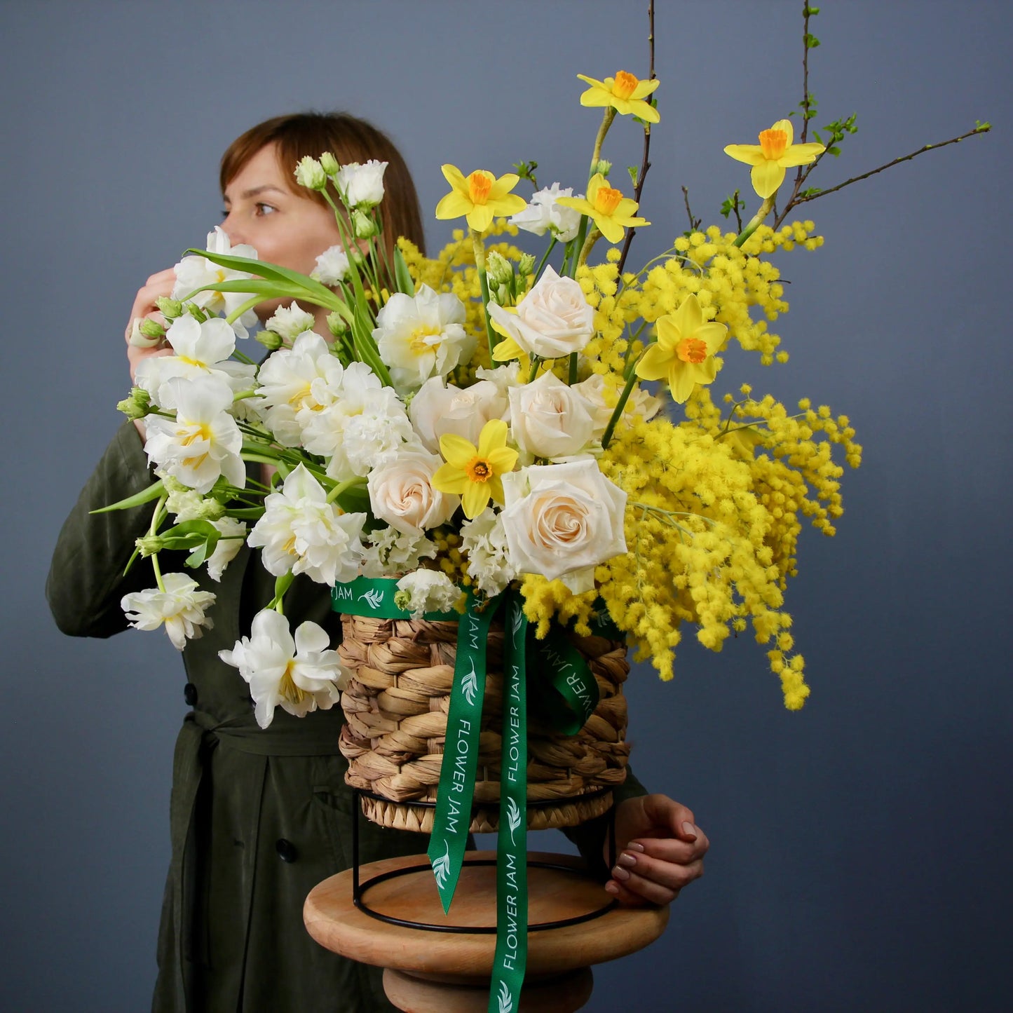 flower bouquet of mimosa, rose and narcissus in a basket floqwer bouquet in genova