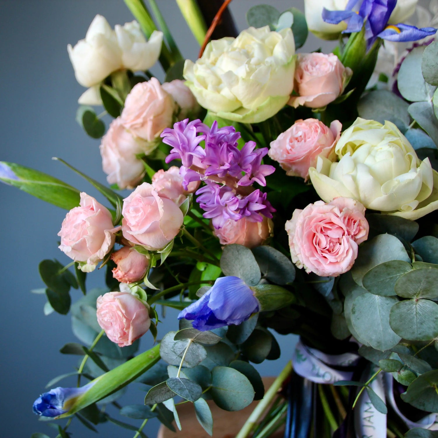 colorful bouquet of flowres with greenery and eucalipts