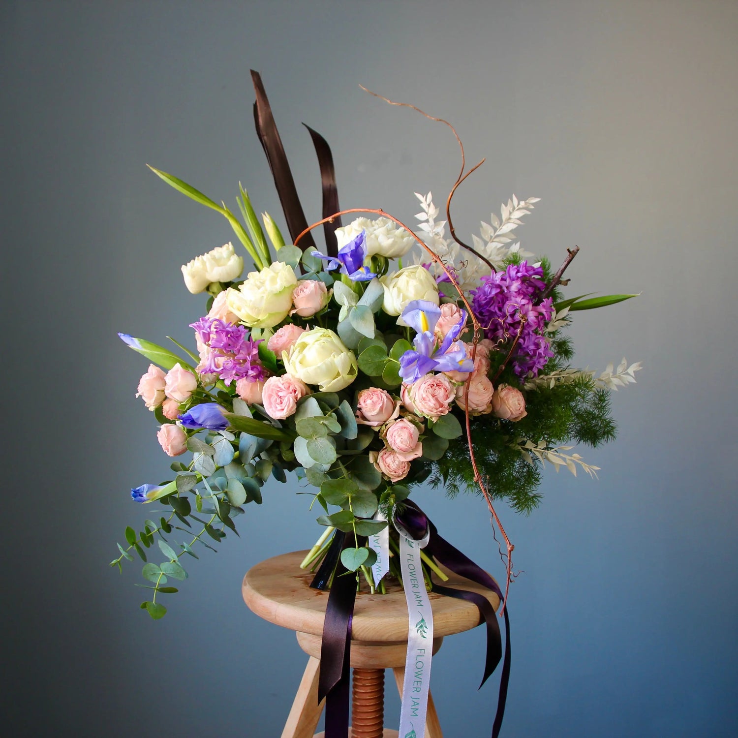 colorful bouquet of flowres with greenery and eucalipts