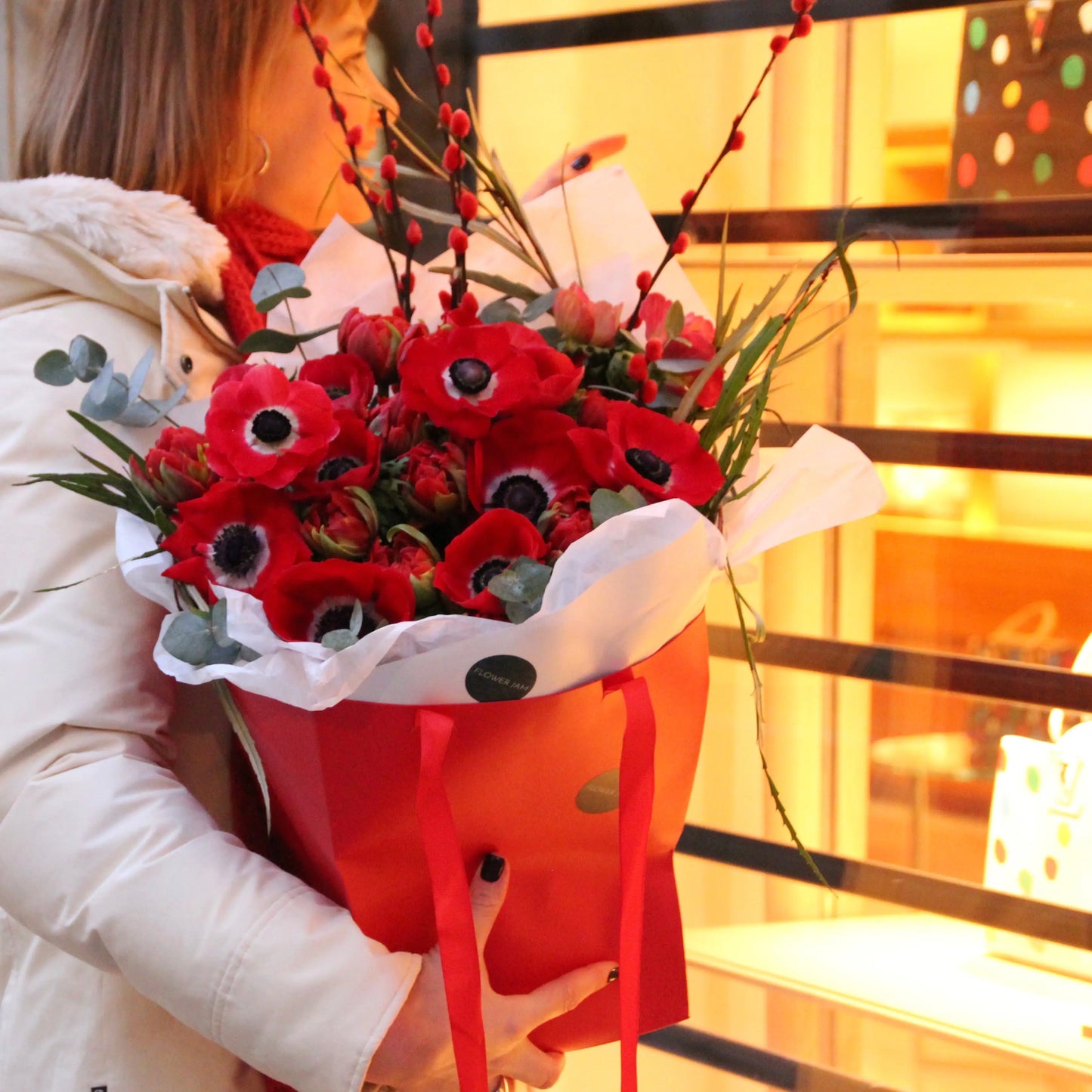 red anemone bouquet in a red box