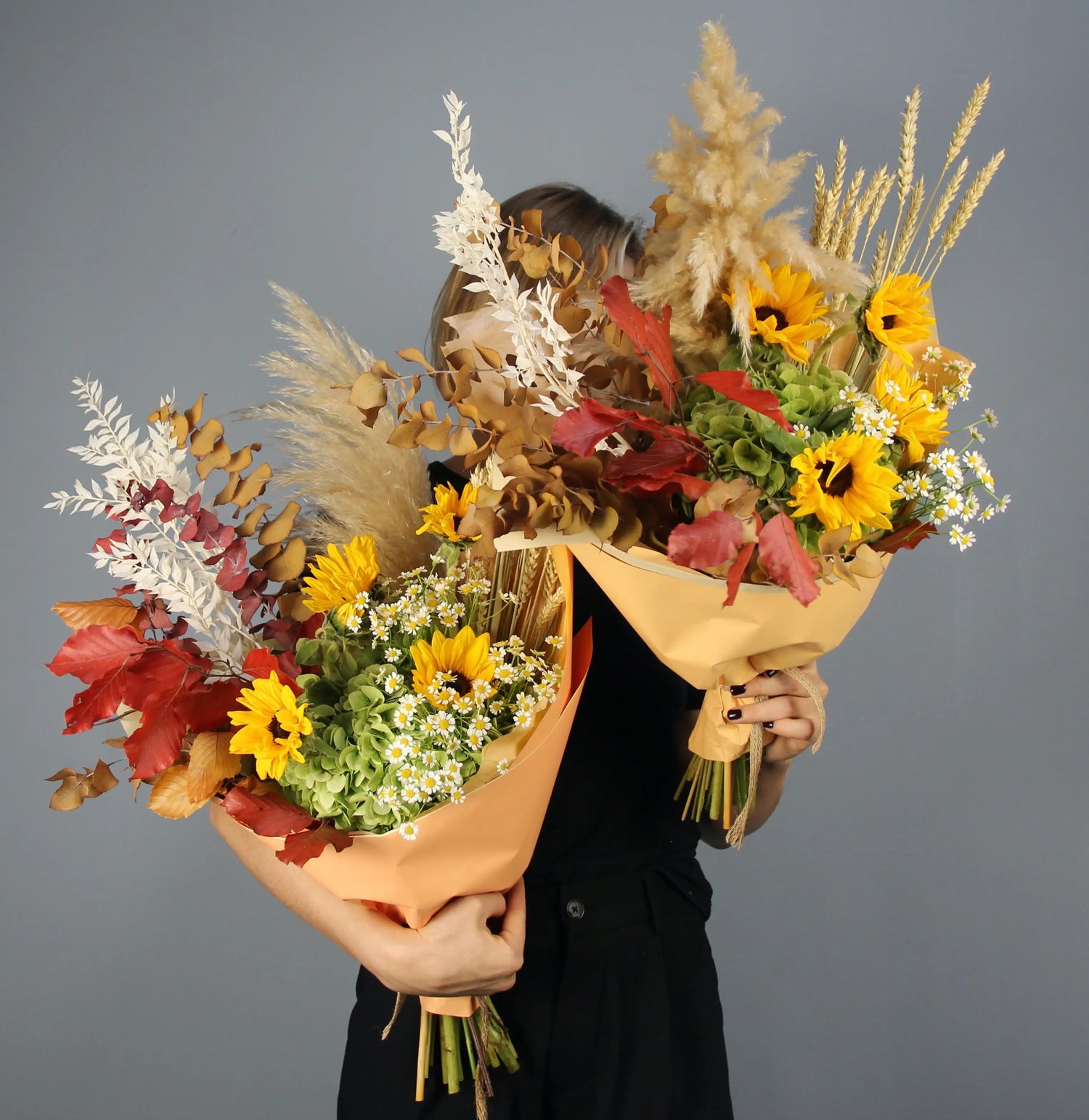 colorful summer bouquet wih brown, yellow, red and white flowers