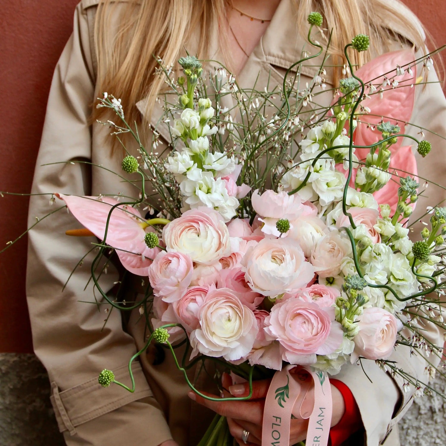 Bouquet of beautiful Ranunculus, Matthiola , Allium , Anthurium and blossom branches.