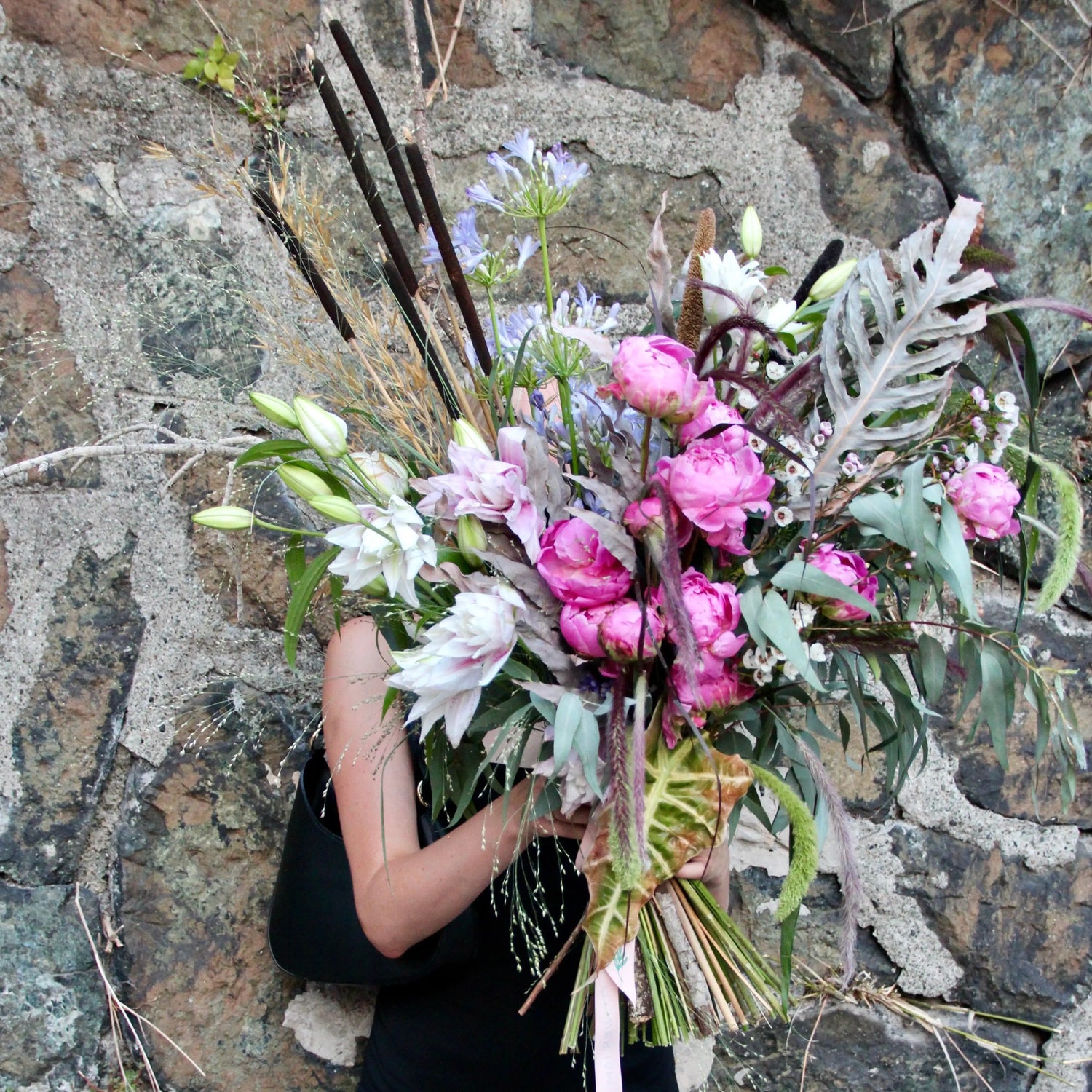 big bouquet with white an pink flowers with a lot of greenery