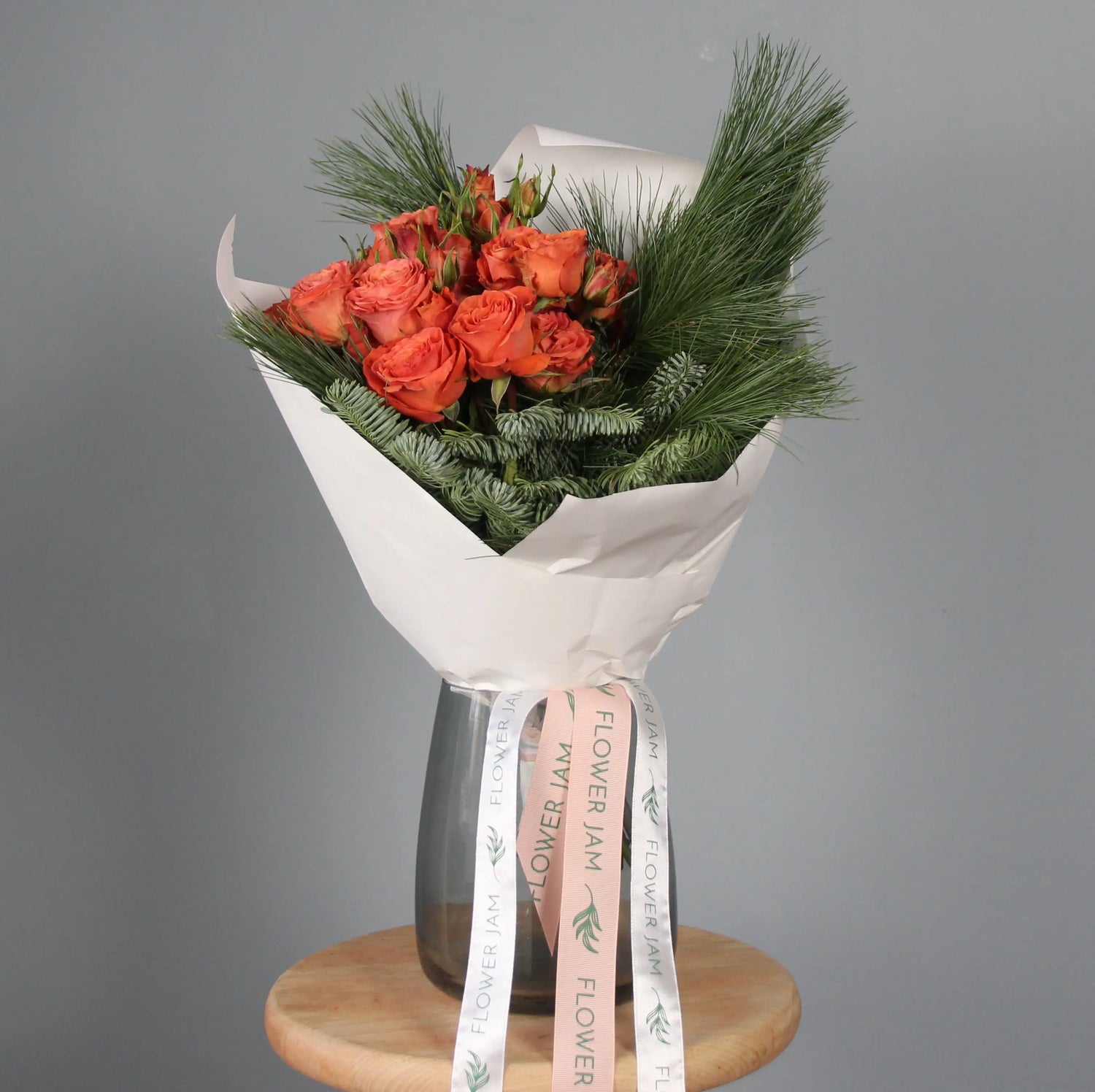 Orange roses and spruce branches bouquet  Bouquet of Flowers