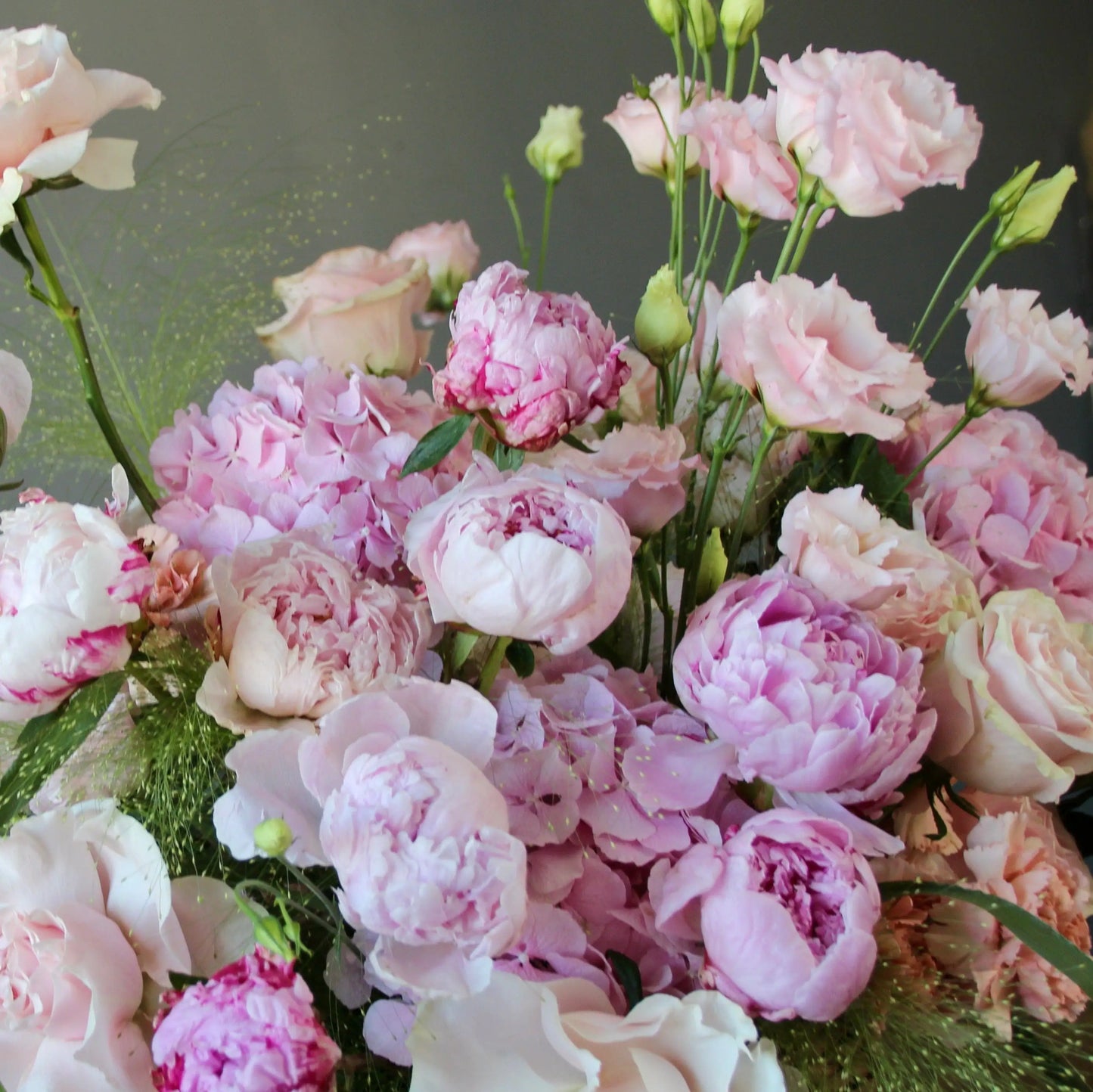 bouquet of pink peonies and greenery