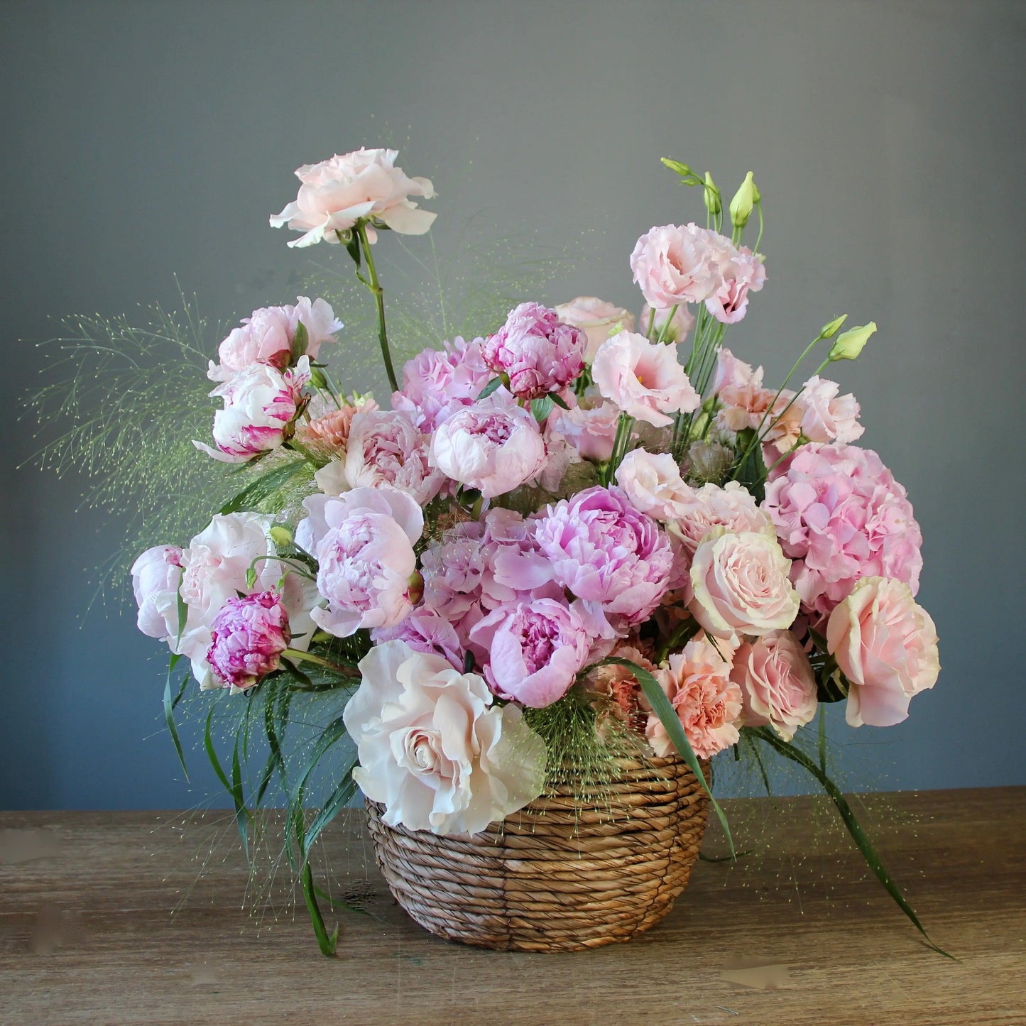 pink peonies in a basket