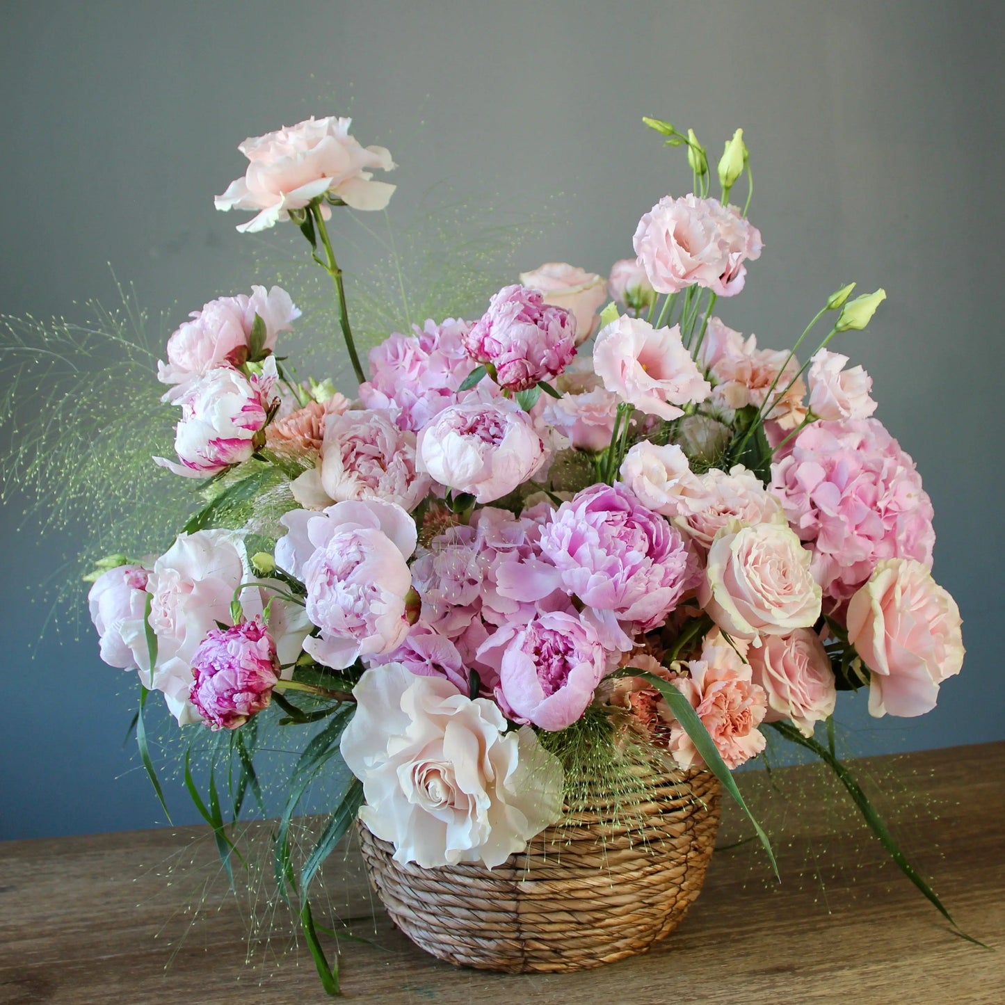 pink peonies in a basket