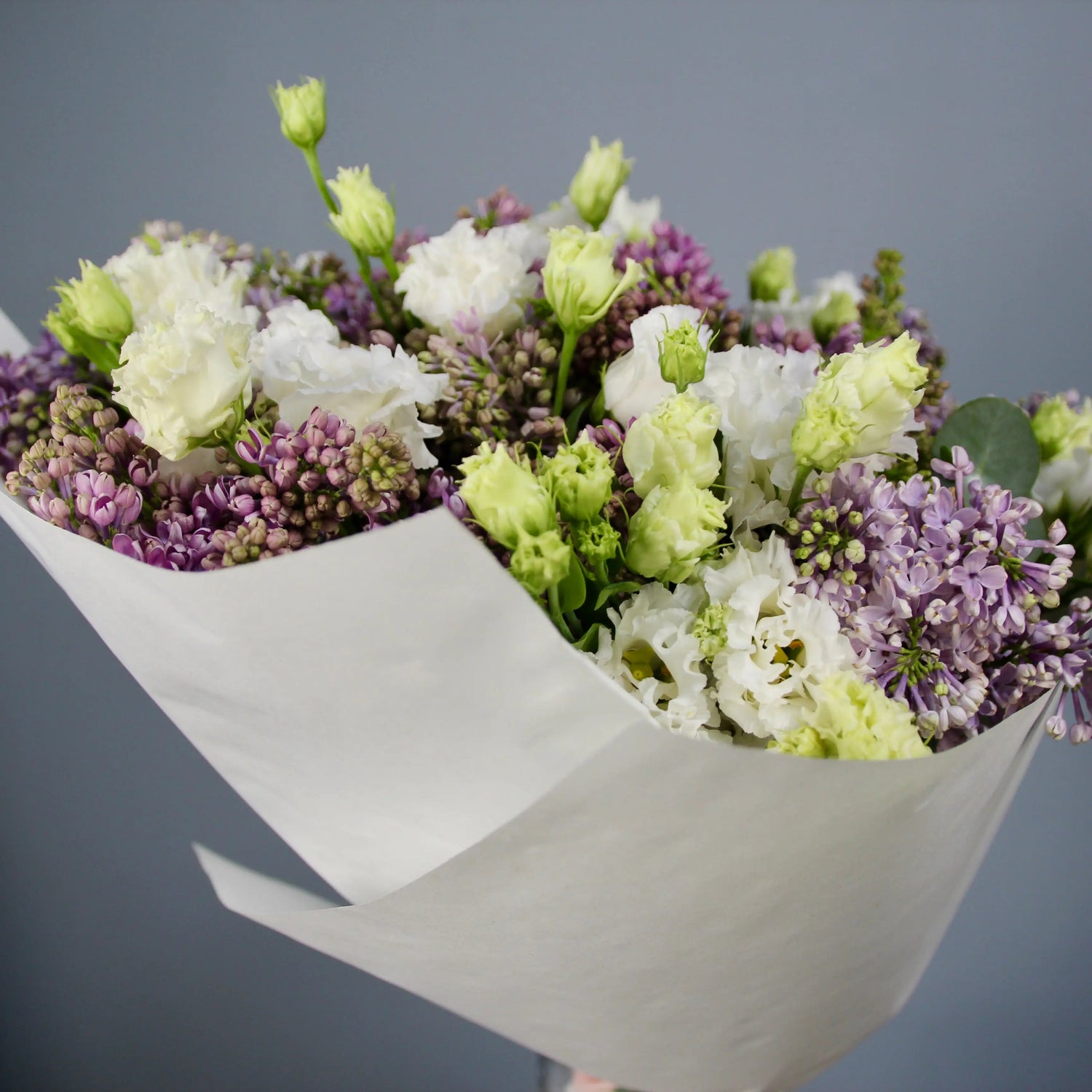 bouquet of syringa blooms and lisianthus