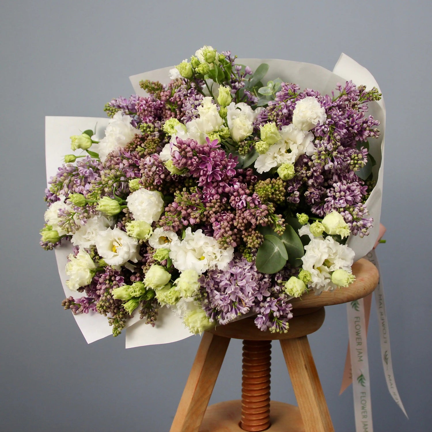 bouquet of syringa blooms and lisianthus
