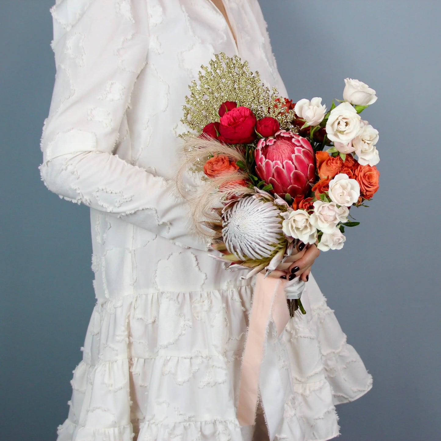 flower arrangement out of red, orange and white flowers
