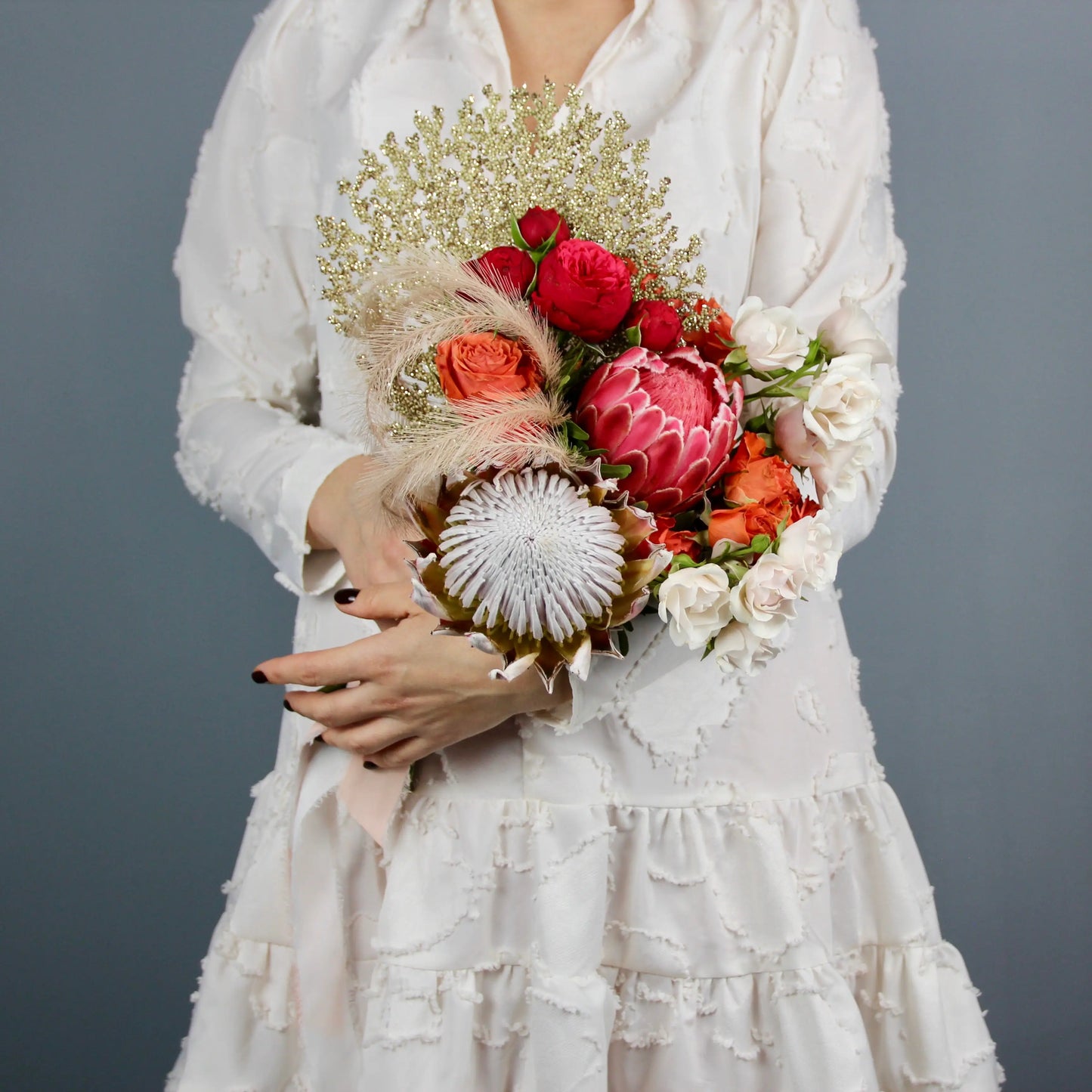 flower arrangement out of red, orange and white flowers