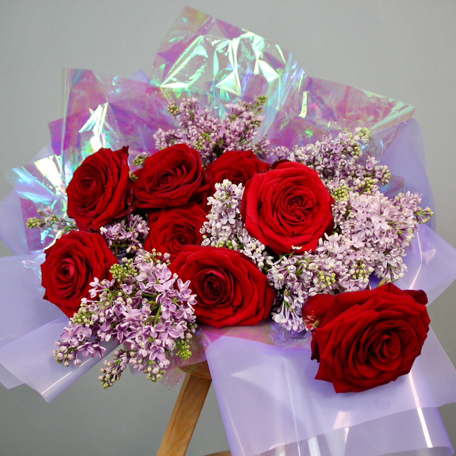 red roses and syringa bouquet