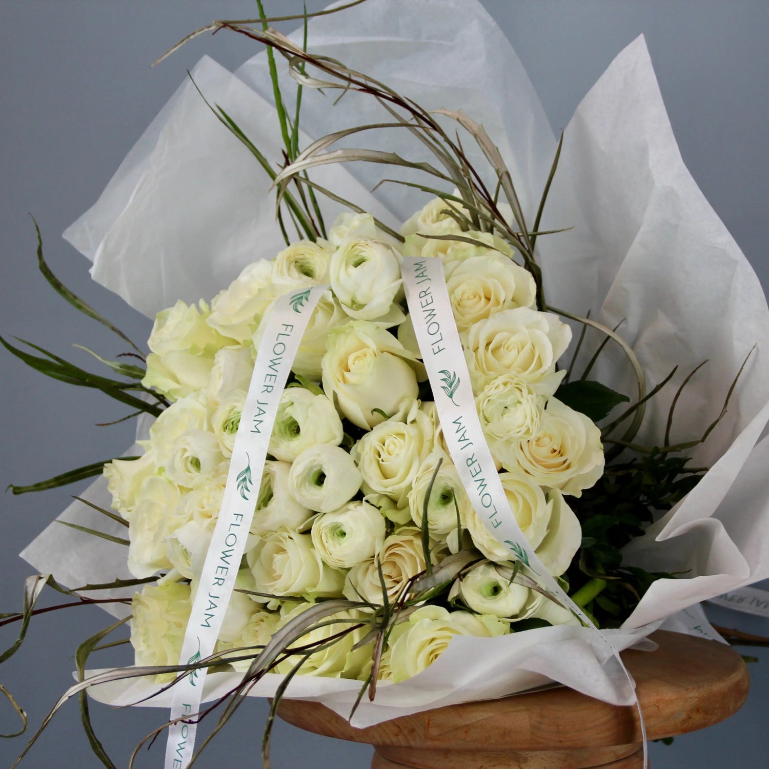 bridal bouquet of white roses and ranunculus