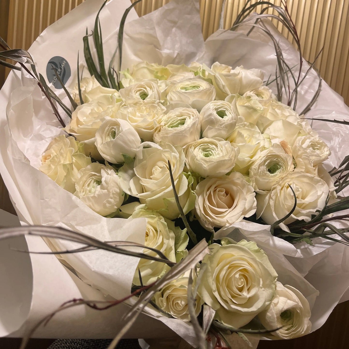bridal bouquet of white roses and ranunculus