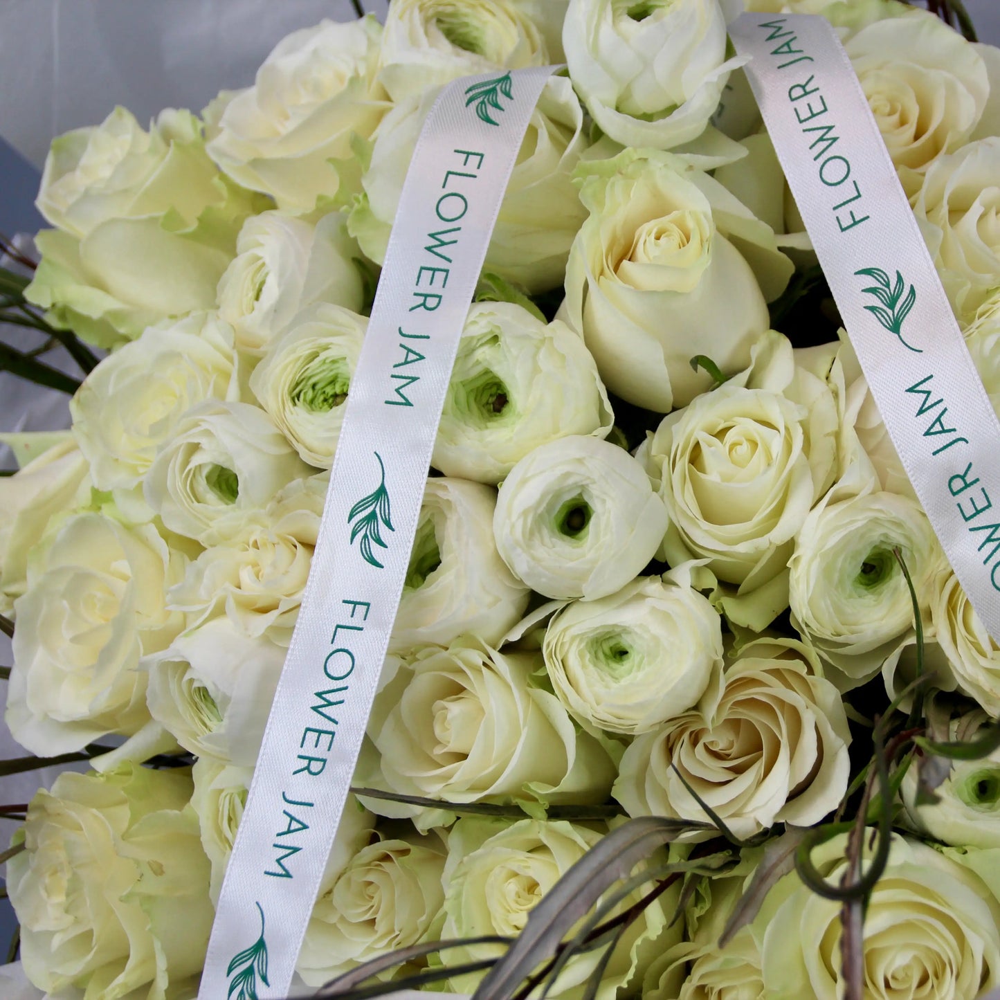 bridal bouquet of white roses and ranunculus