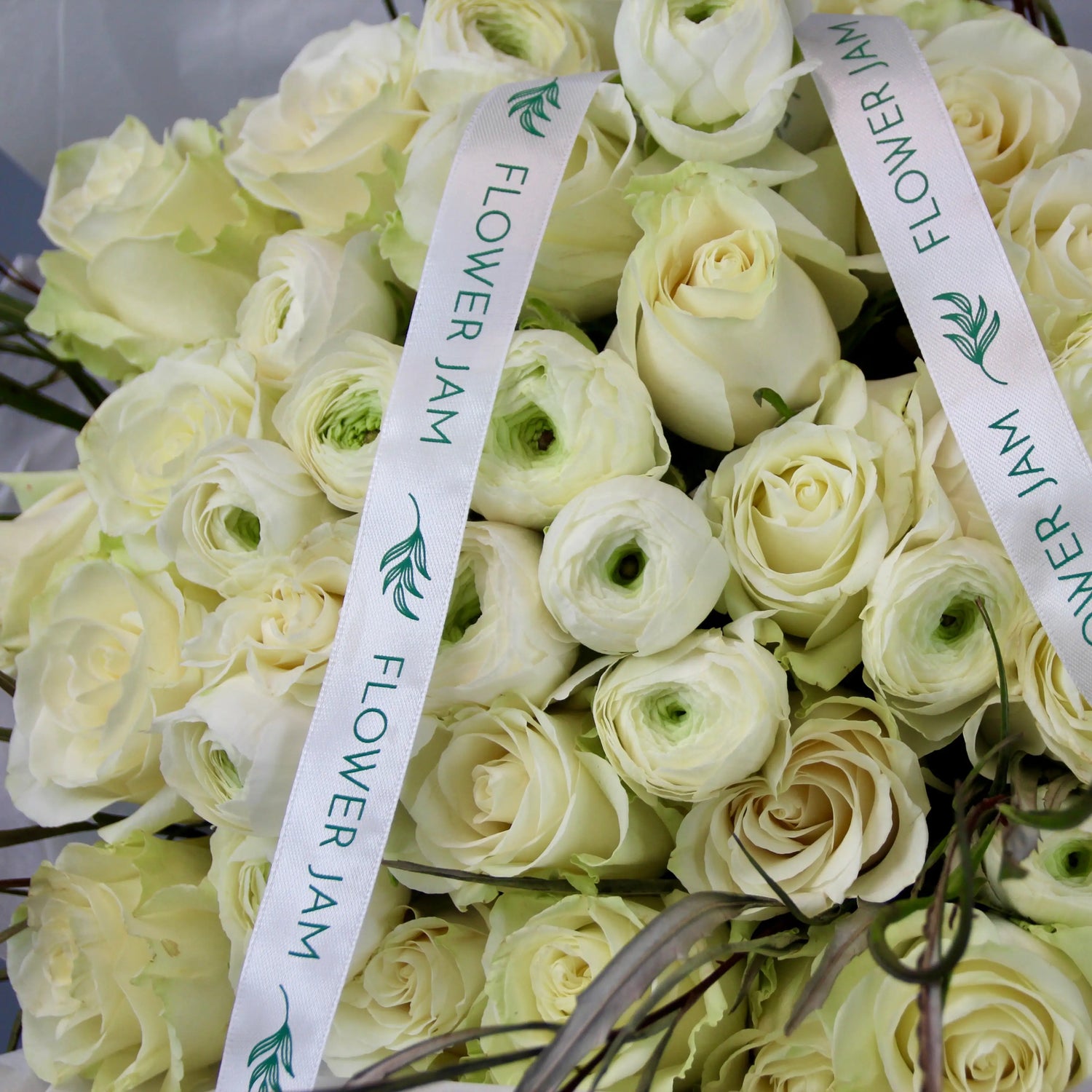 bridal bouquet of white roses and ranunculus