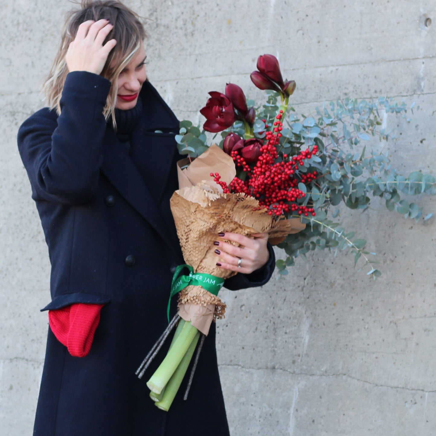 Girl and bunch of red flowers